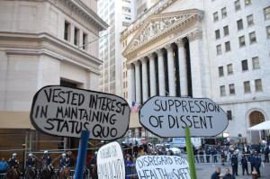 Protest signs in front of wall street
